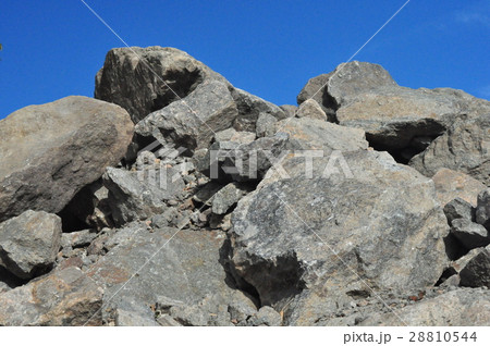 granite stones on a background of blue sky 28810544