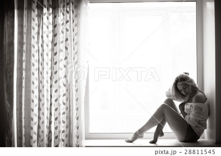 beautiful girl lying at home on a window beautiful girl lying at home on a window 28811545
