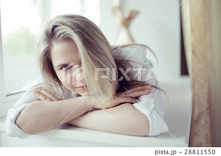 beautiful girl lying at home on a window beautiful girl lying at home on a window 28811550
