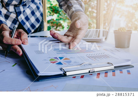 Businessman discussing the analysis charts Businessman discussing the analysis charts 28815371