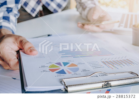 Businessman discussing the analysis charts Businessman discussing the analysis charts 28815372
