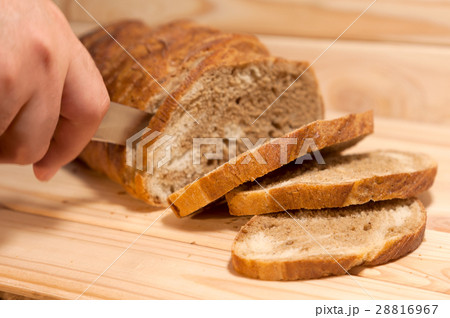 cutting marble Wheat - rye bread on a wooden board 28816967