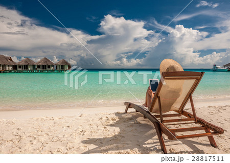 Young woman with tablet pc at the beach 28817511