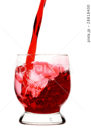 Red wine is being poured into glass, 28818400