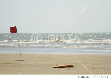 lifeguard surfboard and red flag on the beauty beach lifeguard surfboard and red flag on the beauty beach 28823991