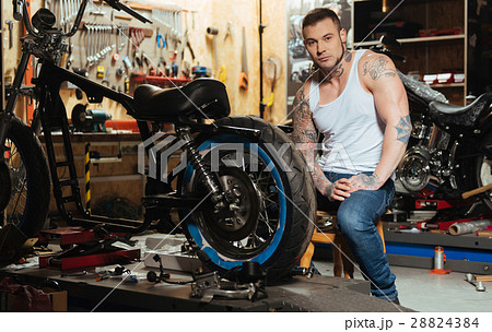 Serious bearded male person holding hands on the Serious bearded male person holding hands on the 28824384