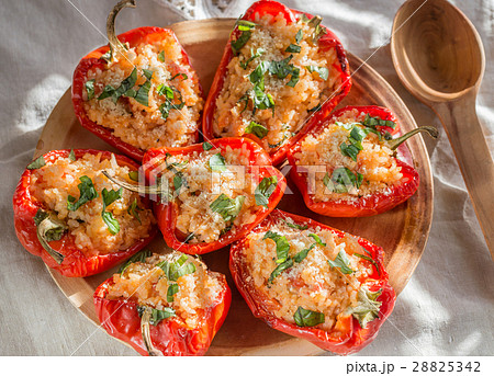Stuffed red bell peppers with rice and cheese Stuffed red bell peppers with rice and cheese 28825342