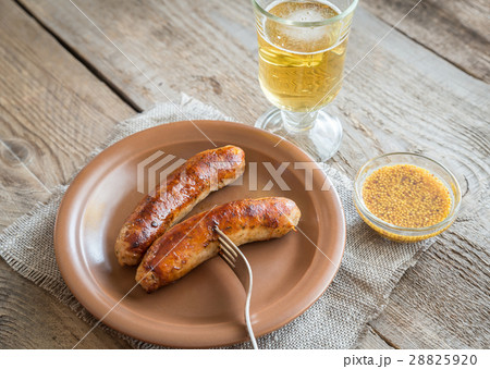Grilled sausages with glass of beer Grilled sausages with glass of beer 28825920