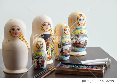 Wooden nested dolls on the table at workshop Wooden nested dolls on the table at workshop 28830249