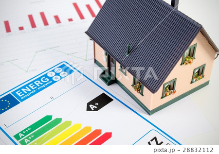 Energy efficiency concept with house model on desk Energy efficiency concept with house model on desk 28832112