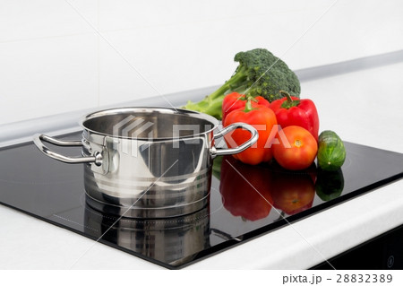 Pot and vegetables in modern kitchen 28832389