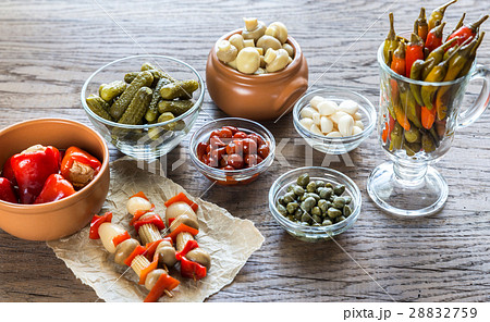 Pickled vegetables on the wooden background 28832759