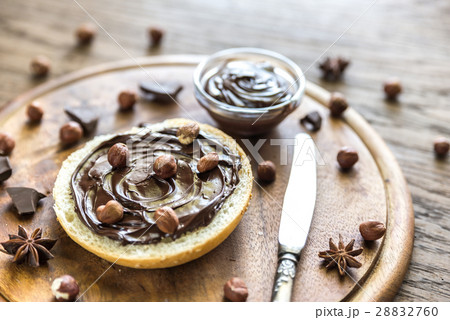 Sesame bun with chocolate cream and nuts Sesame bun with chocolate cream and nuts 28832760