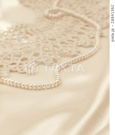 Smooth elegant golden silk or satin with pearls 28841362