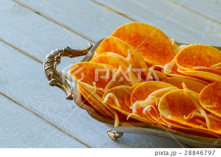 Natural potato chips on wood background Natural potato chips on wood background 28846797