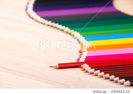 Multicolored pencils on beige wooden table Multicolored pencils on beige wooden table 28848210