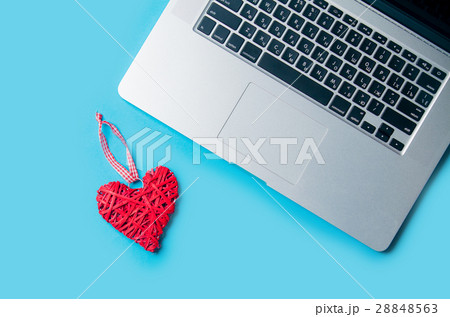 beautiful heart shaped toy lying near laptop on the wonderful bl 28848563