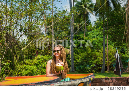 Young woman drinking coconut juice 28849256