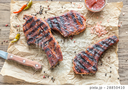 Grilled pork ribs on the baking paper 28850410