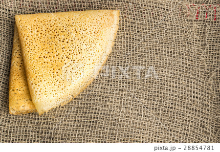 Thin Pancakes on a Burlap Background Top View 28854781