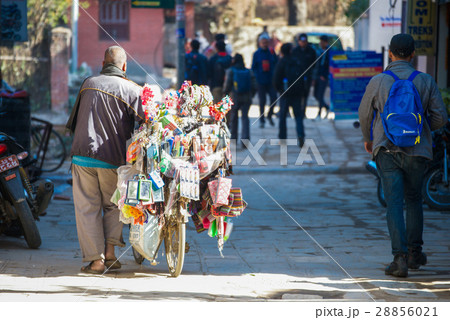 Nepalese merchant sell equipment on the bicycle  28856021