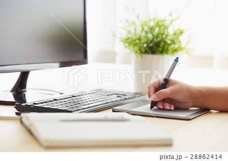 Graphic designer working on a digital tablet Graphic designer working on a digital tablet 28862414