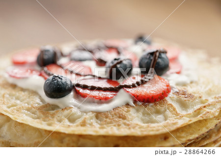 fresh blinis or crepes with fresh berries and 28864266