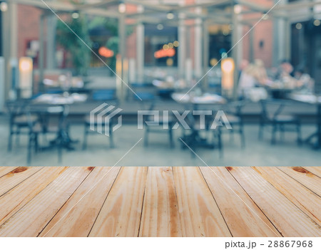 Wooden table with blurred restaurant background 28867968
