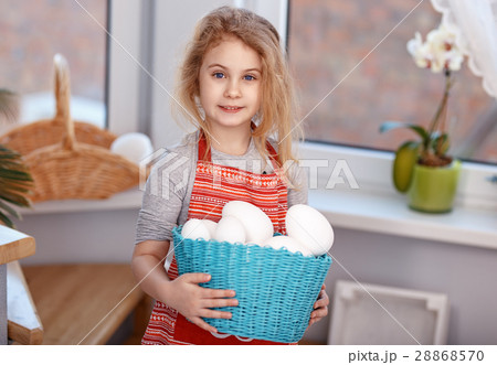 Little blonde girl holding basket with painted Little blonde girl holding basket with painted 28868570
