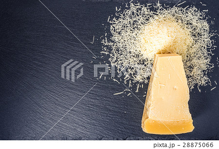 top down of tasty fresh yellow big piece of parm top down of tasty fresh yellow big piece of parm 28875066