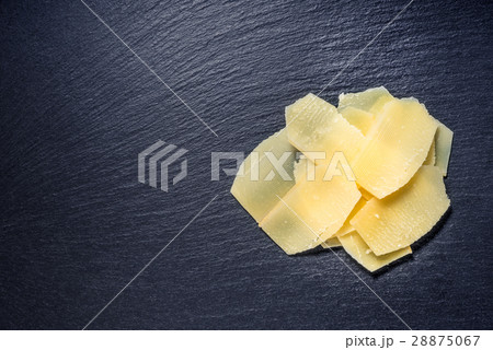 top view of tasty yellow thin slice parm cheese top view of tasty yellow thin slice parm cheese 28875067