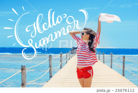 happy woman standing on pier with big white hat happy woman standing on pier with big white hat 28876112