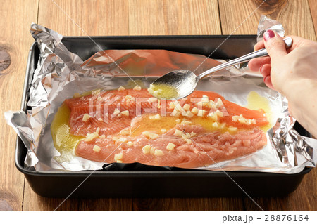 Baked salmon trout, cooking process. Baked salmon trout, cooking process. 28876164