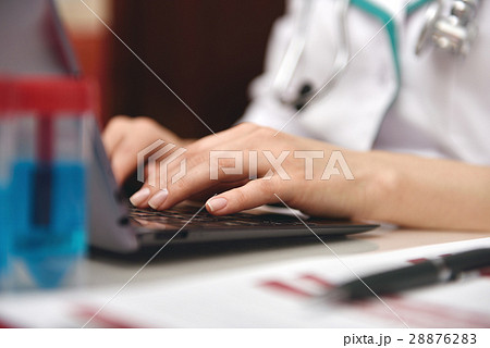 hands typing on laptop hands typing on laptop 28876283