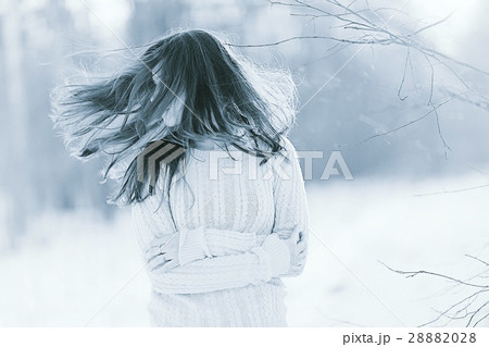unusual toned portrait of a beautiful young girl in winter unusual toned portrait of a beautiful young girl in winter 28882028