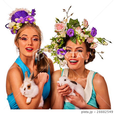 Easter woman together holding bunny. Women in Easter woman together holding bunny. Women in 28882549