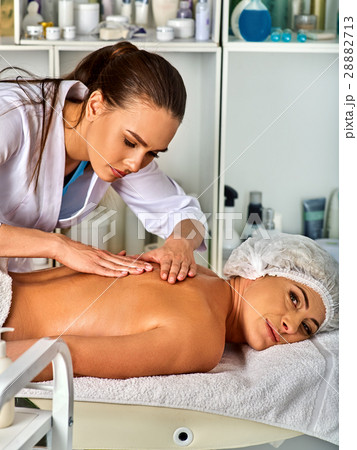 Massage therapy deals. Woman therapist making Massage therapy deals. Woman therapist making 28882713