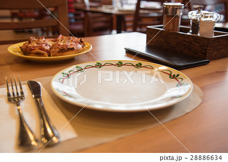 Selective Focus On Dish On Restaurant Wooden Table Selective Focus On Dish On Restaurant Wooden Table 28886634