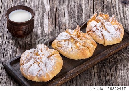 coconut puff pastries  with powdered sugar dusting 28890457