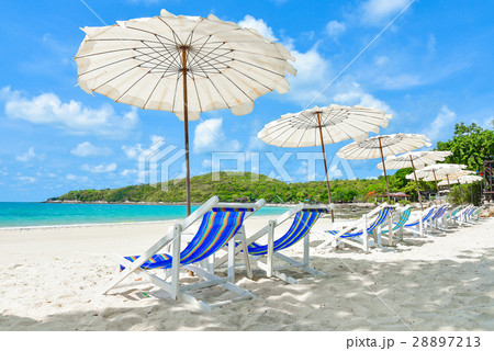 Beach chair on a beach with blue ocean 28897213