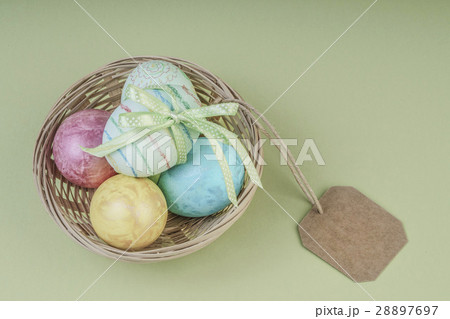 Colorful easter eggs in a basket with name tag 28897697
