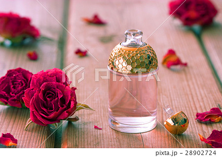 perfume bottle and dry roses perfume bottle and dry roses 28902724