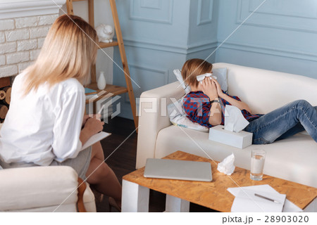 Upset man-child wiping his face Upset man-child wiping his face 28903020