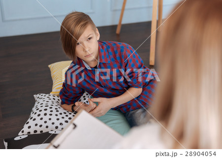 Close up of man-child lying on pillows 28904054
