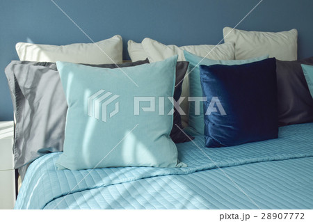 Blue color scheme bedding and white table lamp 28907772