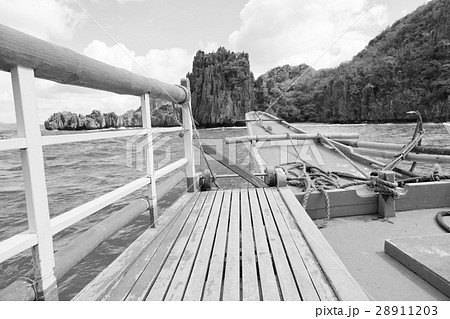 view of the island hill from the prow of a boat 28911203