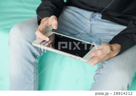 Young businessman holds tablet. Young businessman holds tablet. 28914212