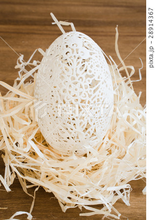 Table Setting for Easter Celebration. Carved Egg. 28914367