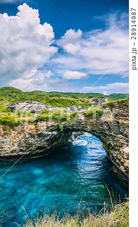 Stone arch over the sea. Broken beach. Rock Stone arch over the sea. Broken beach. Rock 28914987