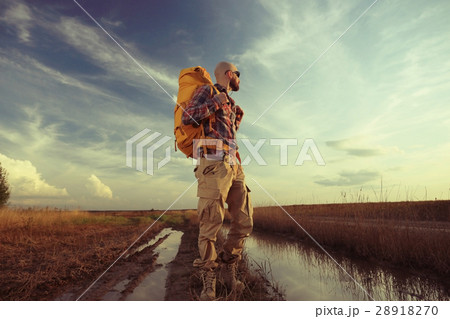man traveler with a backpack wildlife adventure man traveler with a backpack wildlife adventure 28918270